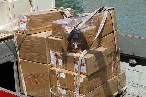 Heavy and fragile boxes tightly secured on a vessel for overseas shipment.