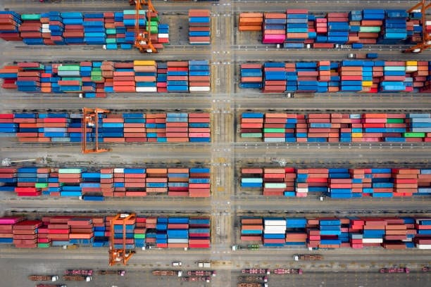 Aerial view of shipping container yard managing exports from Canada to the United States.