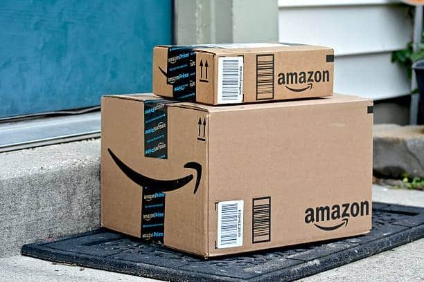Amazon Prime packages at customer doorstep showing proper labeling and packaging compliance.
