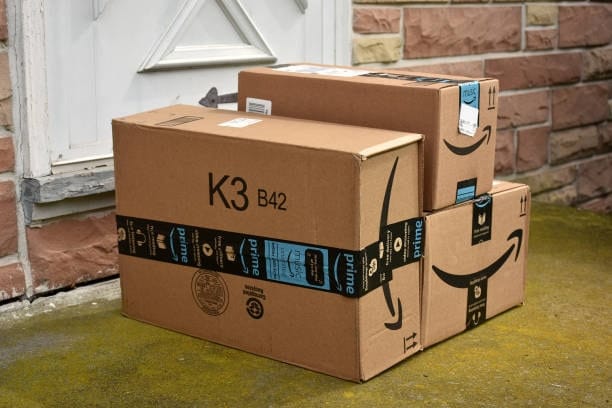 Amazon Prime delivery boxes placed outside front door with proper labeling and tape.