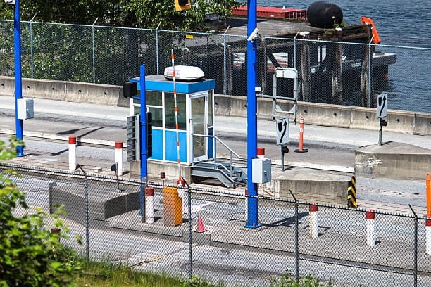 Customs checkpoint at international border for cargo inspection and clearance.