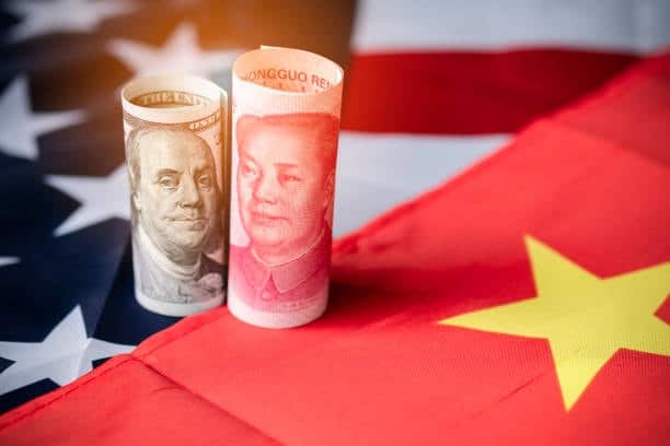 Chinese yuan and US dollar symbolizing currency exchange rates affecting shipping costs from China to the US.