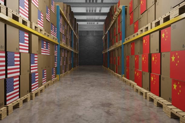 Warehouse filled with export boxes labeled with China and USA flags for international trade and shipping.