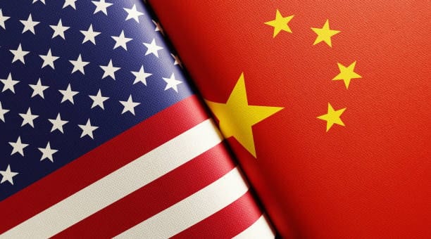 Close-up of US and China flags side by side, representing the trade relationship and customs regulations between both countries.
