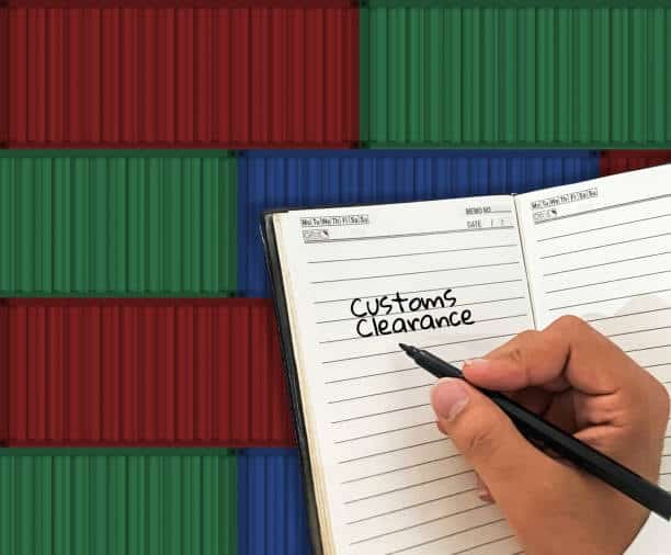 Customs clearance written in a logistics journal with background of stacked containers.