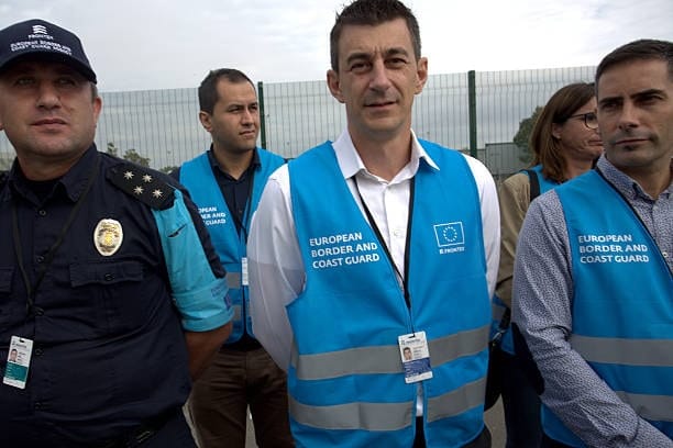 European customs officers and border control team managing import clearance.