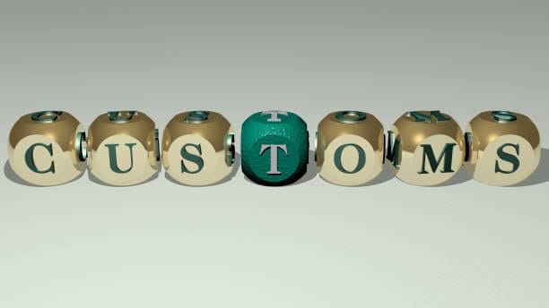 3D letter cubes spelling the word customs, symbolizing customs clearance process.