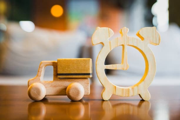 Wooden delivery truck and clock representing fast shipping from Canada to the US.