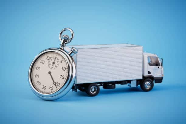 Truck and stopwatch symbolizing express shipping services from Canada to the US.