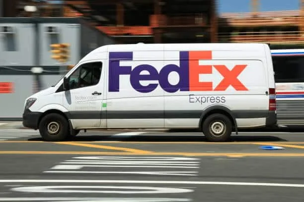 FedEx van representing buyer-arranged transport in EXW Incoterms.