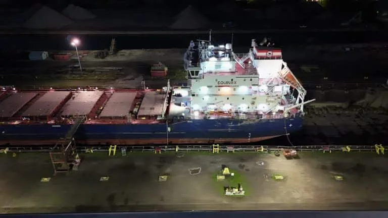 Cargo vessel docked at port representing shipping under Ex Works (EXW) terms.