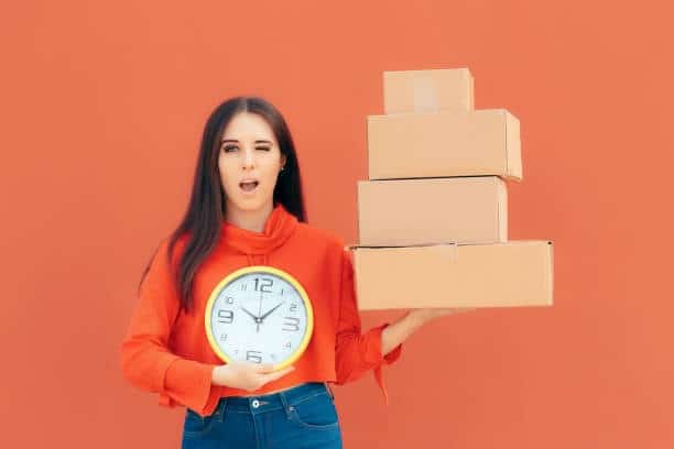Woman holding multiple packages and a clock symbolizing fast shipping from Canada to the United States.