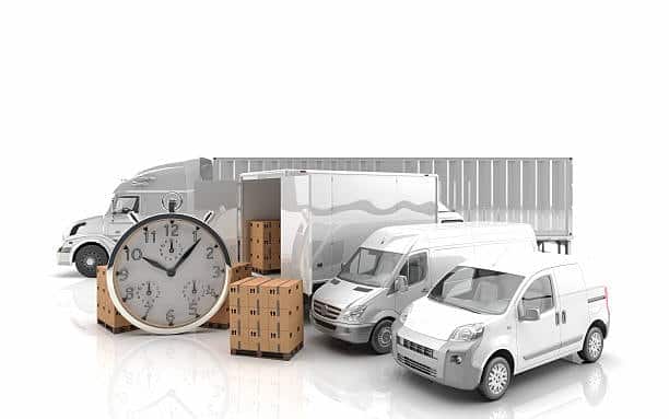 Freight trucks, cargo boxes, and clock illustrating shipping logistics from Canada to the US.