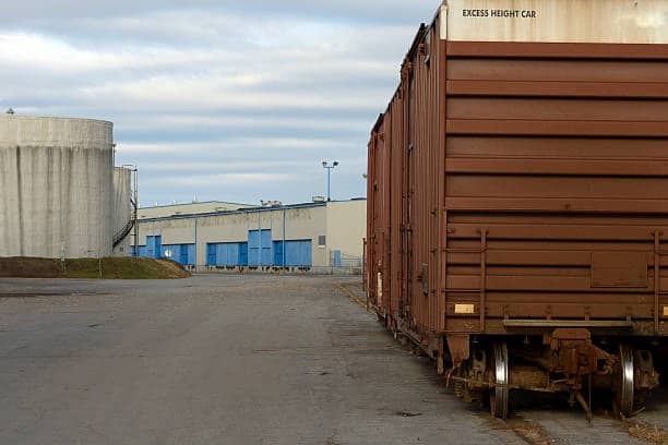 Freight boxcar at distribution center prepared for outbound shipment.