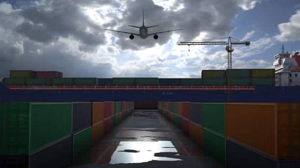 Airplane flying over cargo containers, illustrating multimodal freight out logistics.