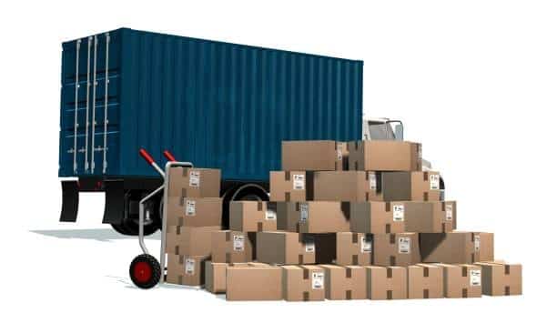 Truck with shipping container and stacked cardboard boxes for freight out.