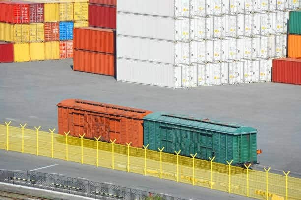 Freight boxcars in container yard ready for outbound transportation.