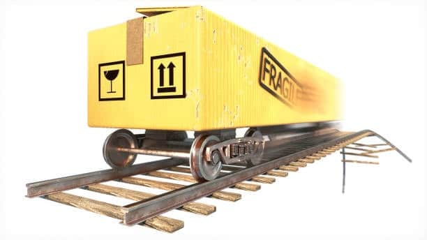 Rail car carrying a large fragile container to represent outbound freight shipping.
