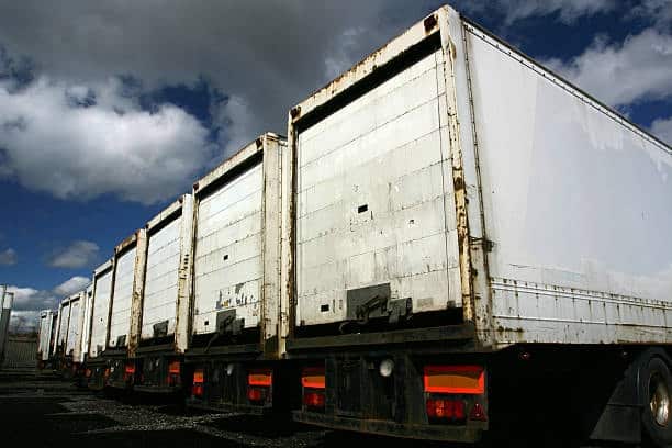 Parked freight trailers awaiting loading for outbound shipments.