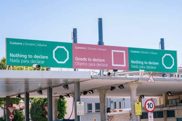 Customs checkpoint with signage for goods to declare and nothing to declare.