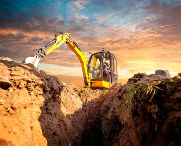 Mini excavator digging trench on construction site – ideal for compact earthwork exports from Alibaba.