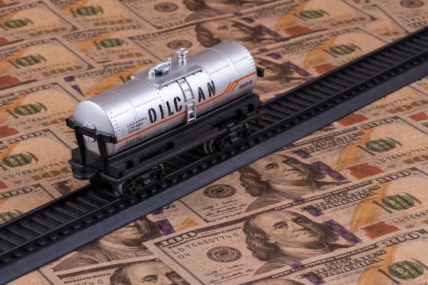 Freight oil tanker on railroad with USD background showing cost-bearing under CPT shipping.