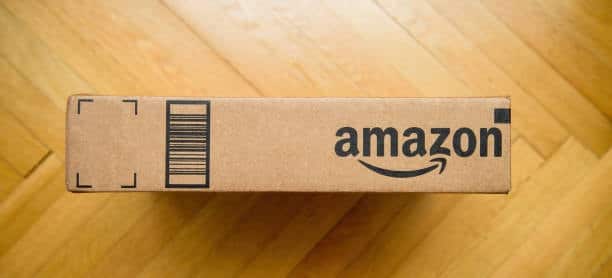 Flat Amazon shipping box with barcode and Amazon logo on the side panel.