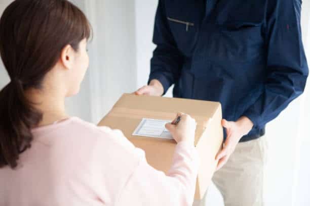Customer signing for a delivered package shipped from Canada to the United States.