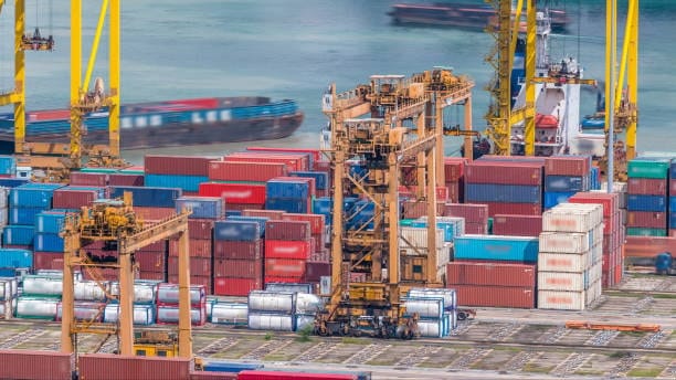 Busy seaport with shipping containers ready for transport from Canada to the United States.