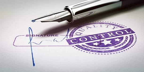 Signing a quality control certificate required for COC shipping compliance.