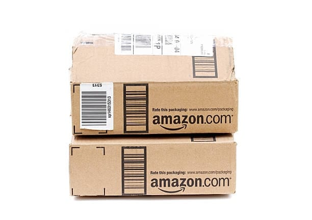 Two stacked Amazon packages showing barcode and shipping label for proper packaging compliance.