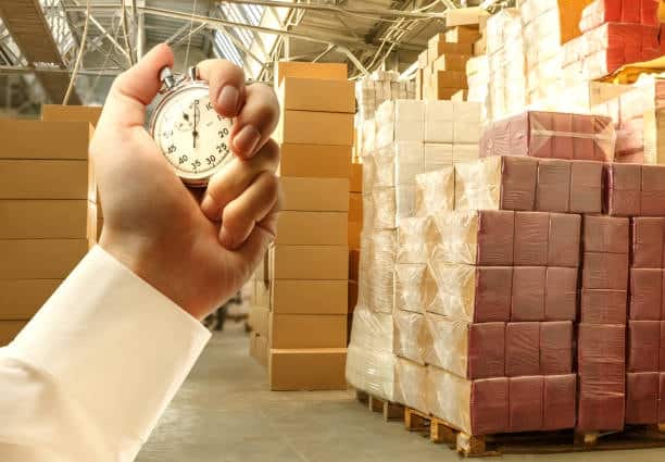 Warehouse logistics and stopwatch emphasizing shipping time from Canada to the US.