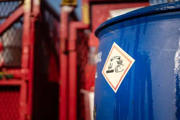 Barrel with corrosive material label for dangerous goods shipping