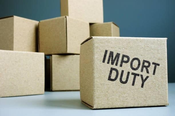 Cardboard boxes highlighting import duty charges for Japanese goods.