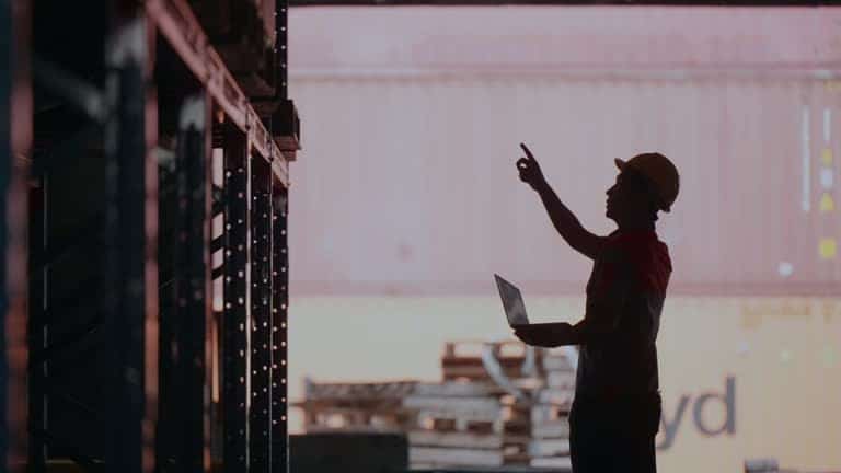 Worker inspecting import shipments from France