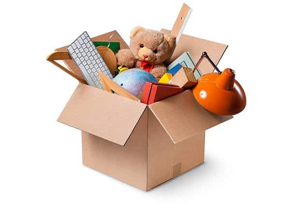 Cardboard box filled with toys and other items prepared for import shipping.