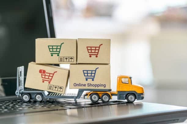 Mini truck carrying online shopping boxes symbolizing import fees for goods from Japan.