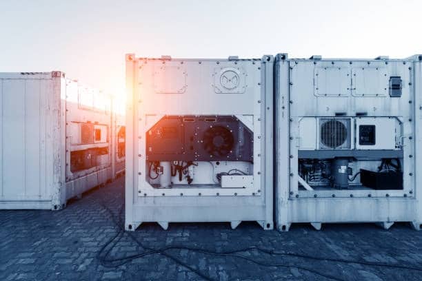 Refrigerated shipping containers representing TEU units in logistics