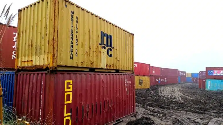 Storage area with rusty SOC shipping containers