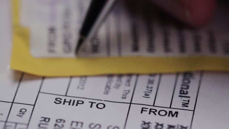 Filling out shipping documents for Bill of Lading issuance.